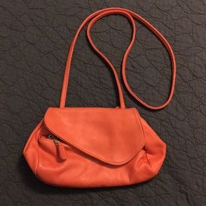 Expandable coral leather crossbody bag